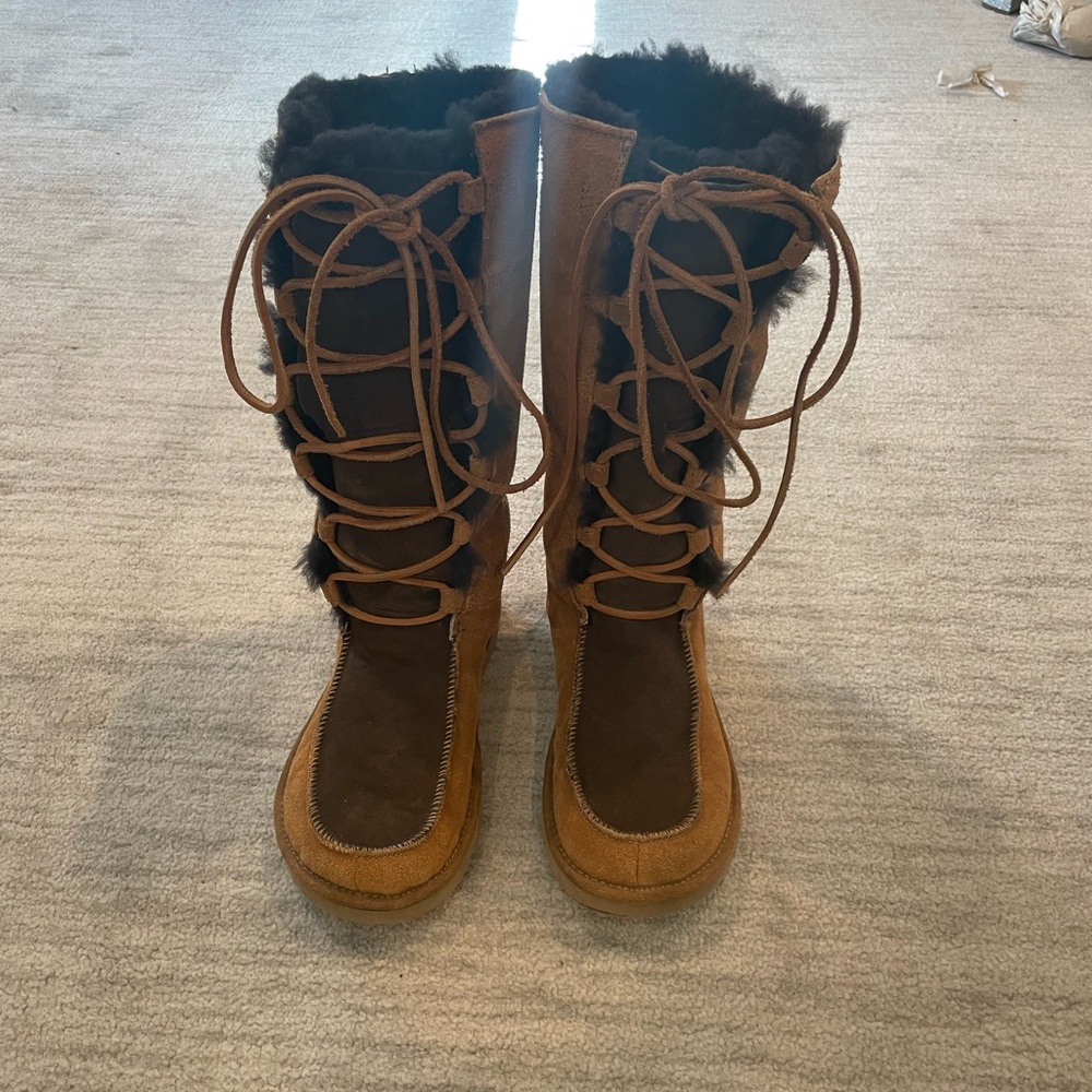 Tall tie up UGG women boots.